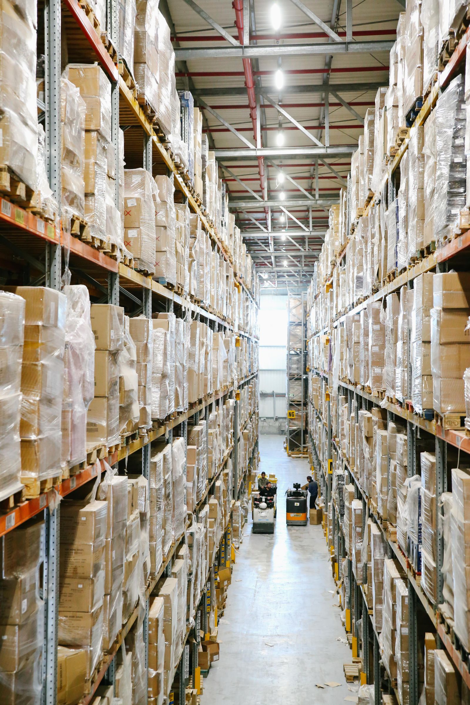 Organised warehouse aisle with stored boxes
